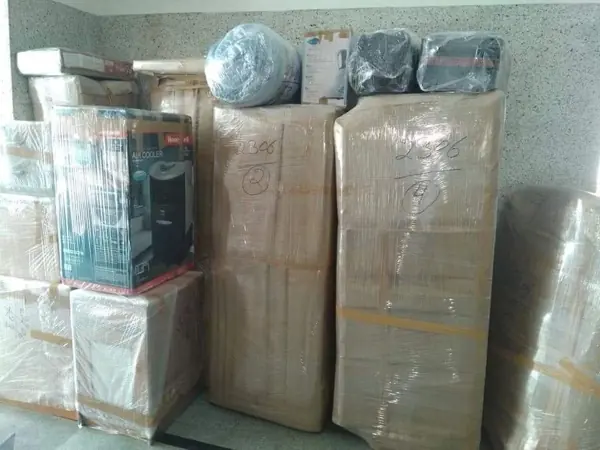 Cartons and appliances packed by Dev International crew