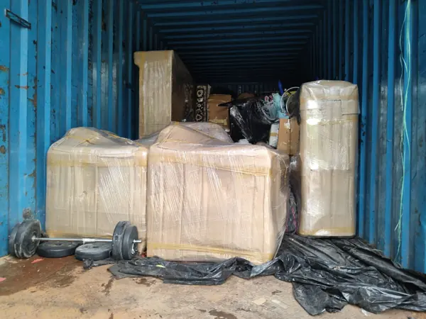 Closed container truck loaded with household goods