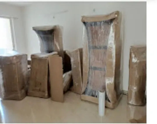 Mirror and wardrobe covered in cardboard