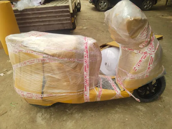 Scooter secured with cardboard and stretch film