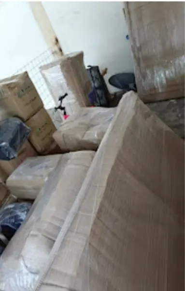 Sofa covered with cardboard and film