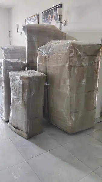 Sealed cartons stacked inside a room