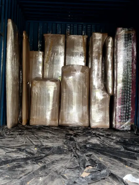 Goods tied and stacked inside a moving truck