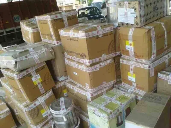 Sealed cartons stored in a covered warehouse