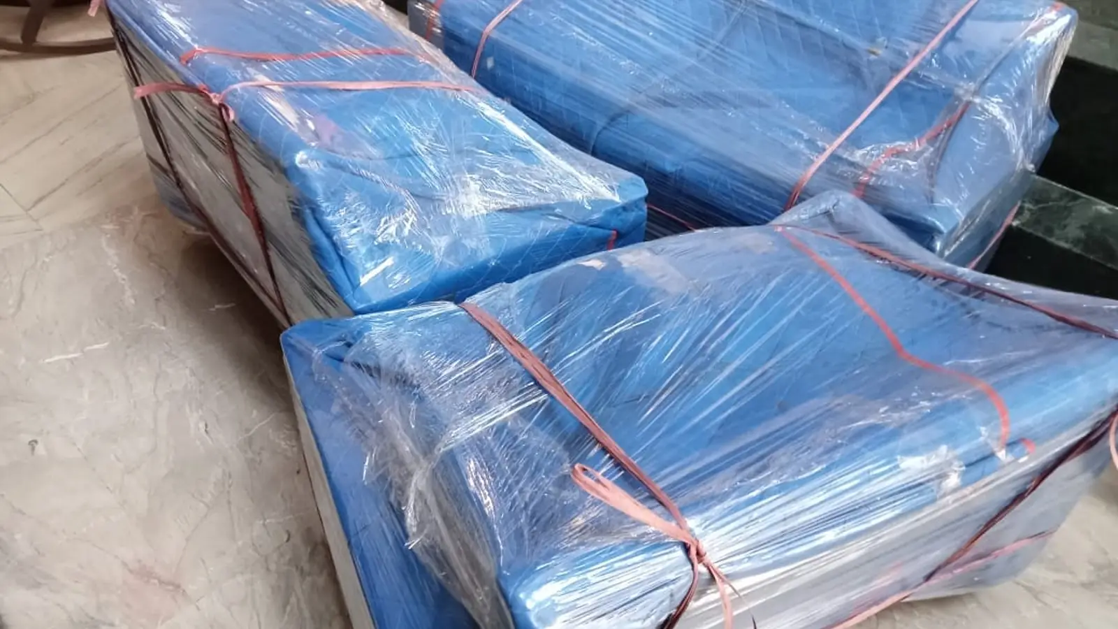 Sofa protected with waterproof cover before shifting
