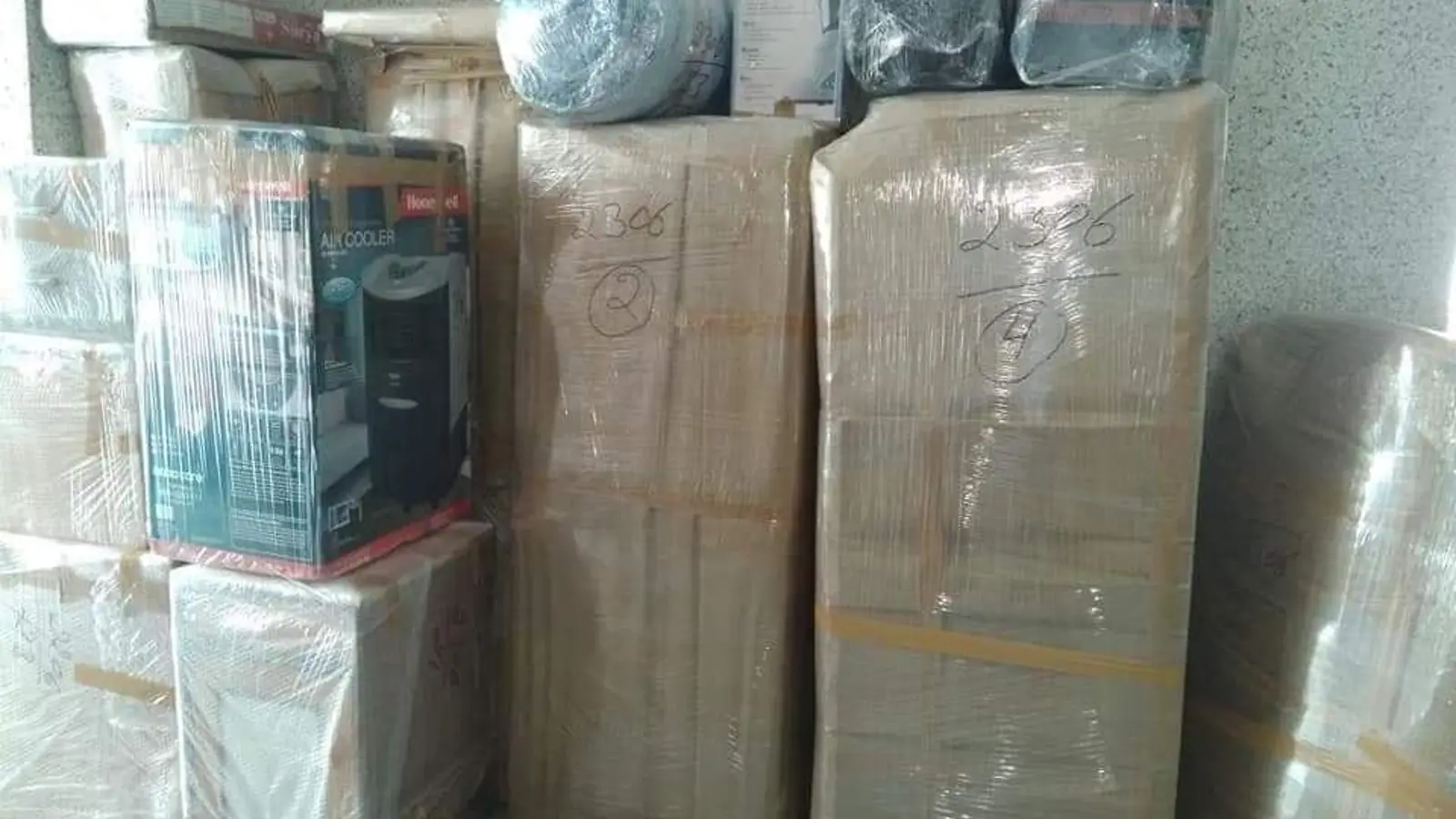 Cartons and appliances packed for a household move